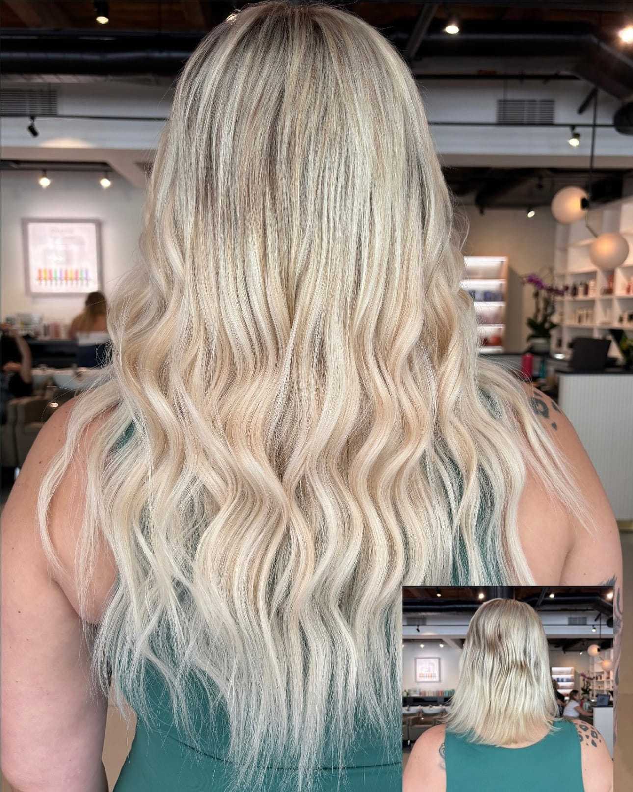Long wavy blonde hair transformation in a salon setting.